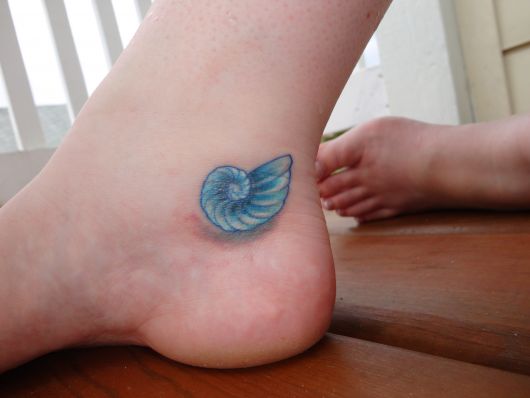 Tatouage coquillage : 35 modèles pour s'inspirer !