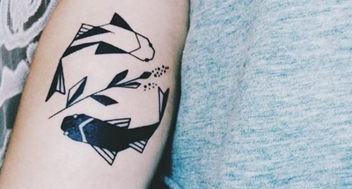 Tatouage de poisson : signification et 30 idées pour s'inspirer